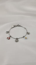 Bracciale con charms margherita coccinella e quadrifoglio
