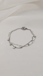Bracciale doppia catena con simboli e perle