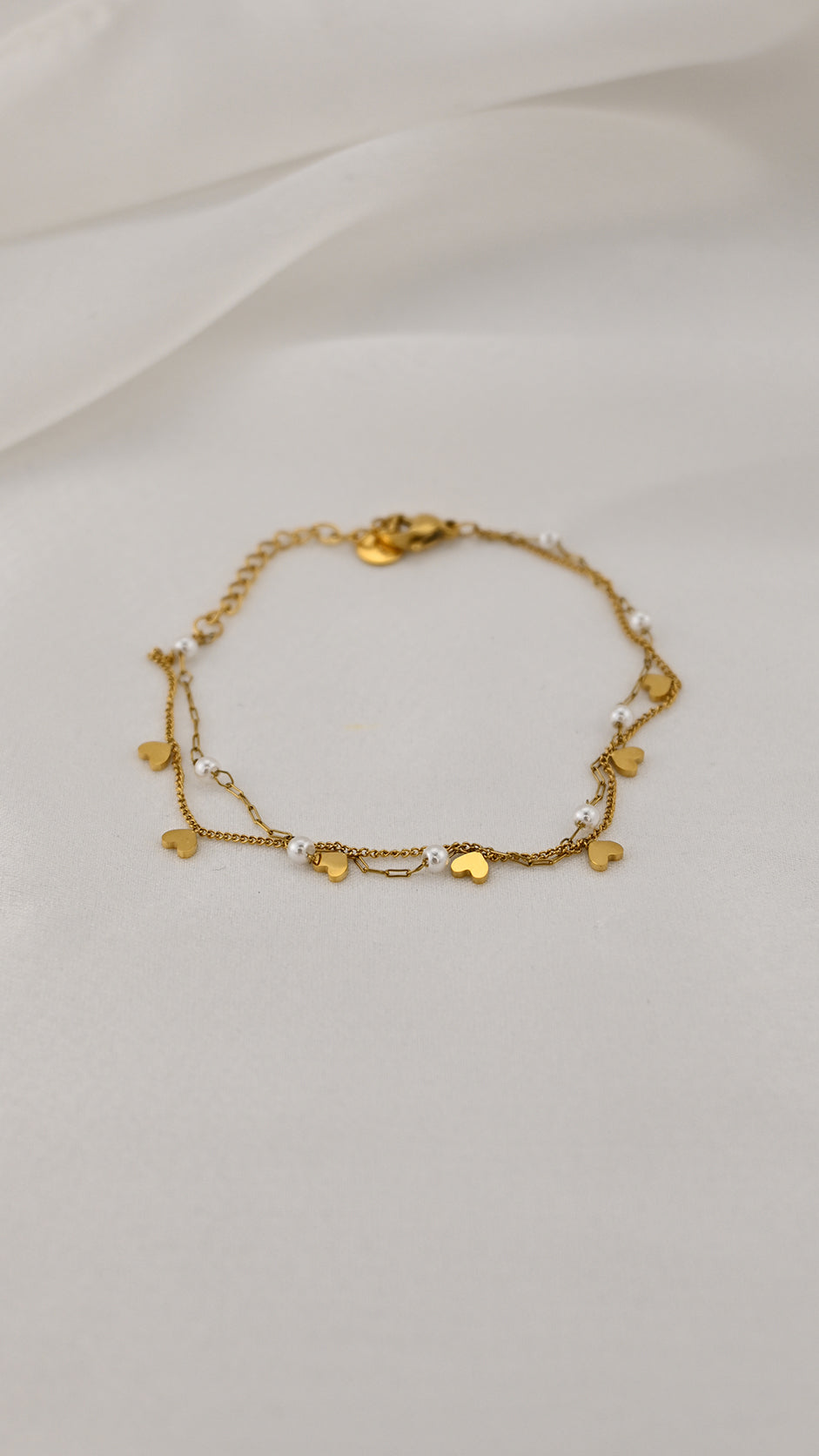 Bracciale doppia catena con simboli e perle