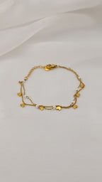 Bracciale doppia catena con simboli e perle
