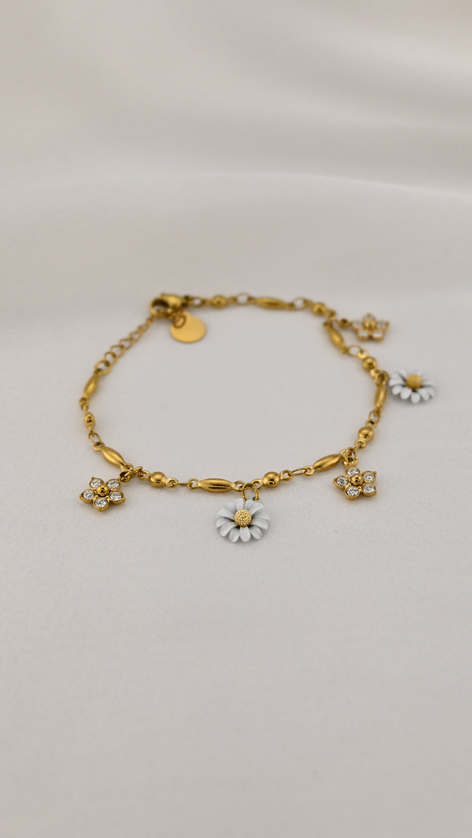 Bracciale dorato con margherita e fiori con cristalli