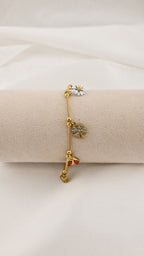 Bracciale con charms margherita coccinella e quadrifoglio
