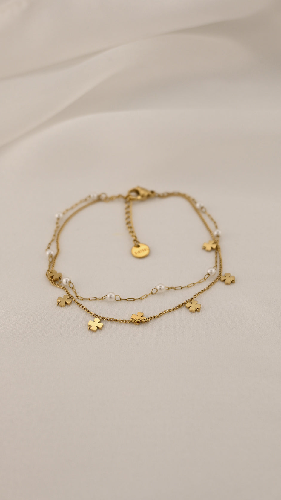 Bracciale doppia catena con simboli e perle