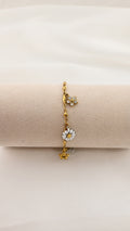 Bracciale dorato con margherita e fiori con cristalli