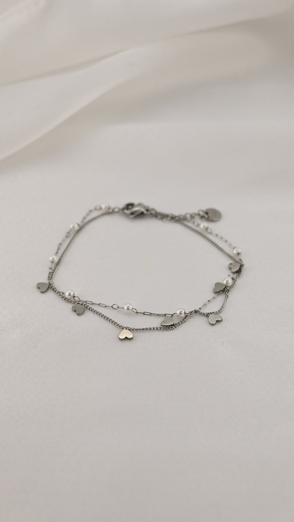 Bracciale doppia catena con simboli e perle