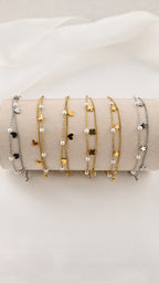 Bracciale doppia catena con simboli e perle