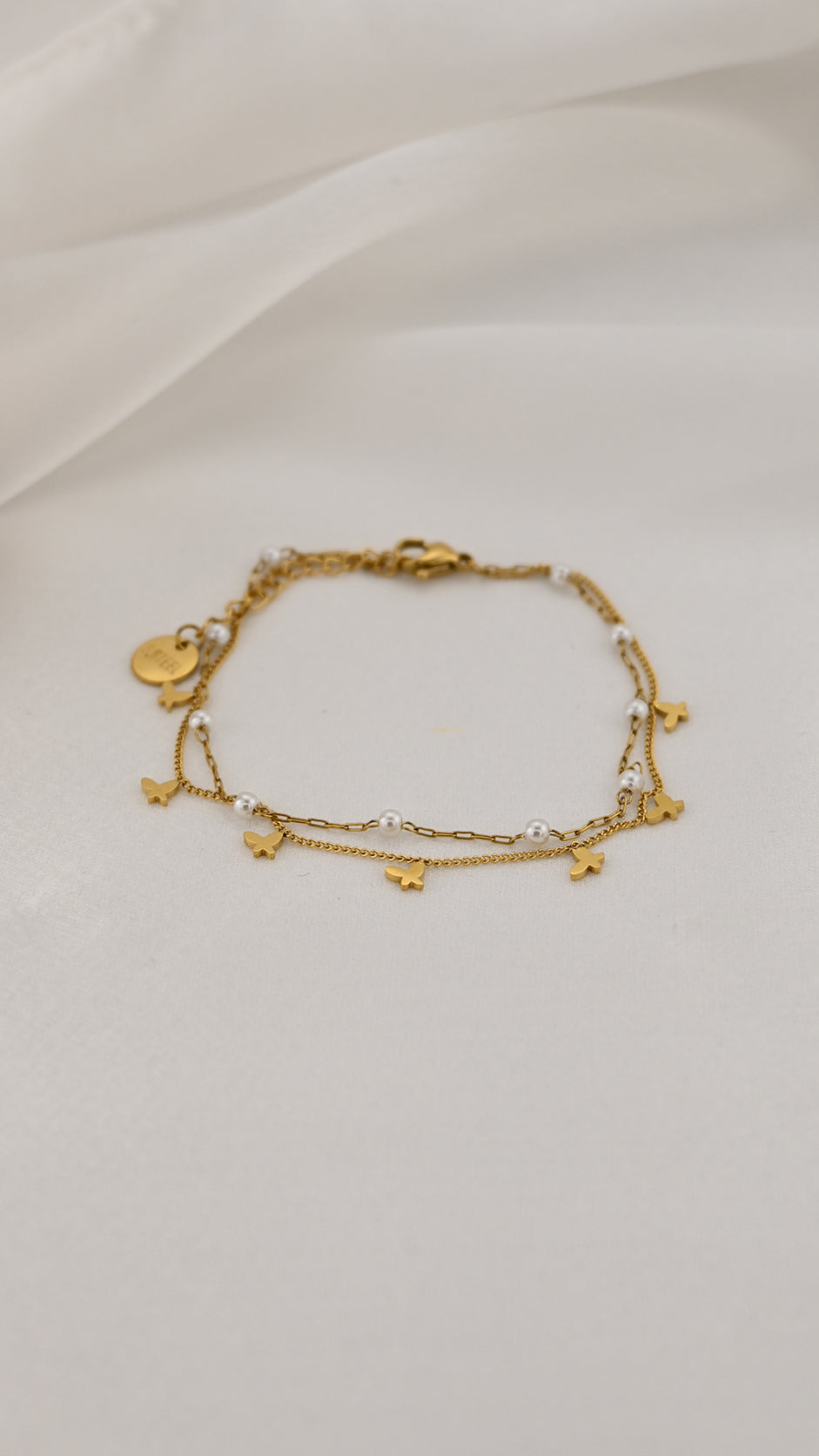 Bracciale doppia catena con simboli e perle