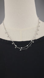 Collana doppia catena con simboli e perle