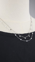 Collana doppia catena con simboli e perle