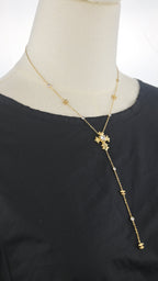 Collana con pendente verticale e croce decorata