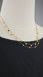 Collana doppia catena con simboli e perle