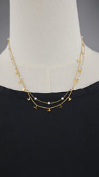 Collana doppia catena con simboli e perle