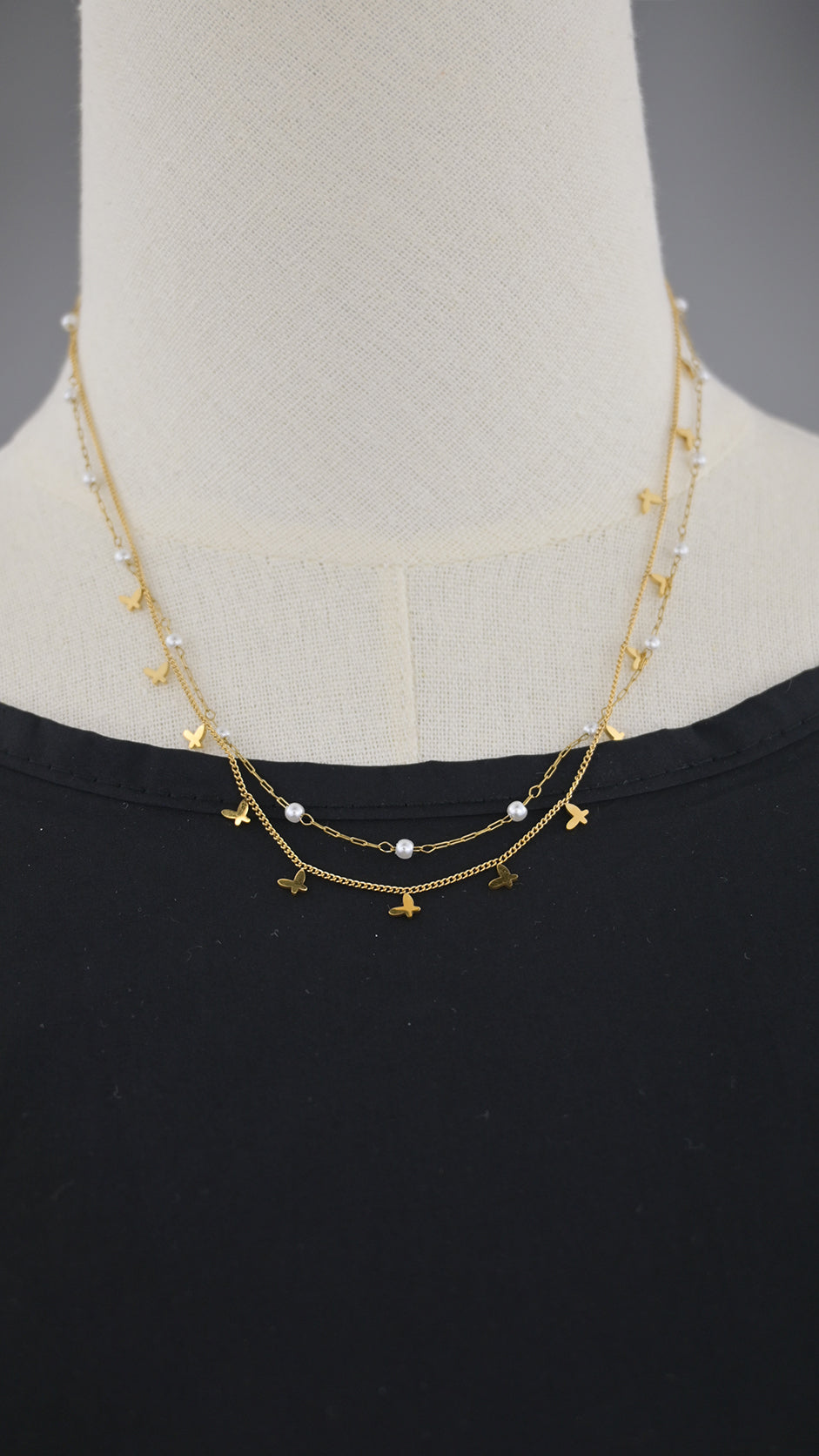 Collana doppia catena con simboli e perle