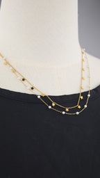 Collana doppia catena con simboli e perle