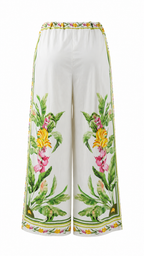 Pantaloni palazzo con stampe tropicali e dettagli animalier