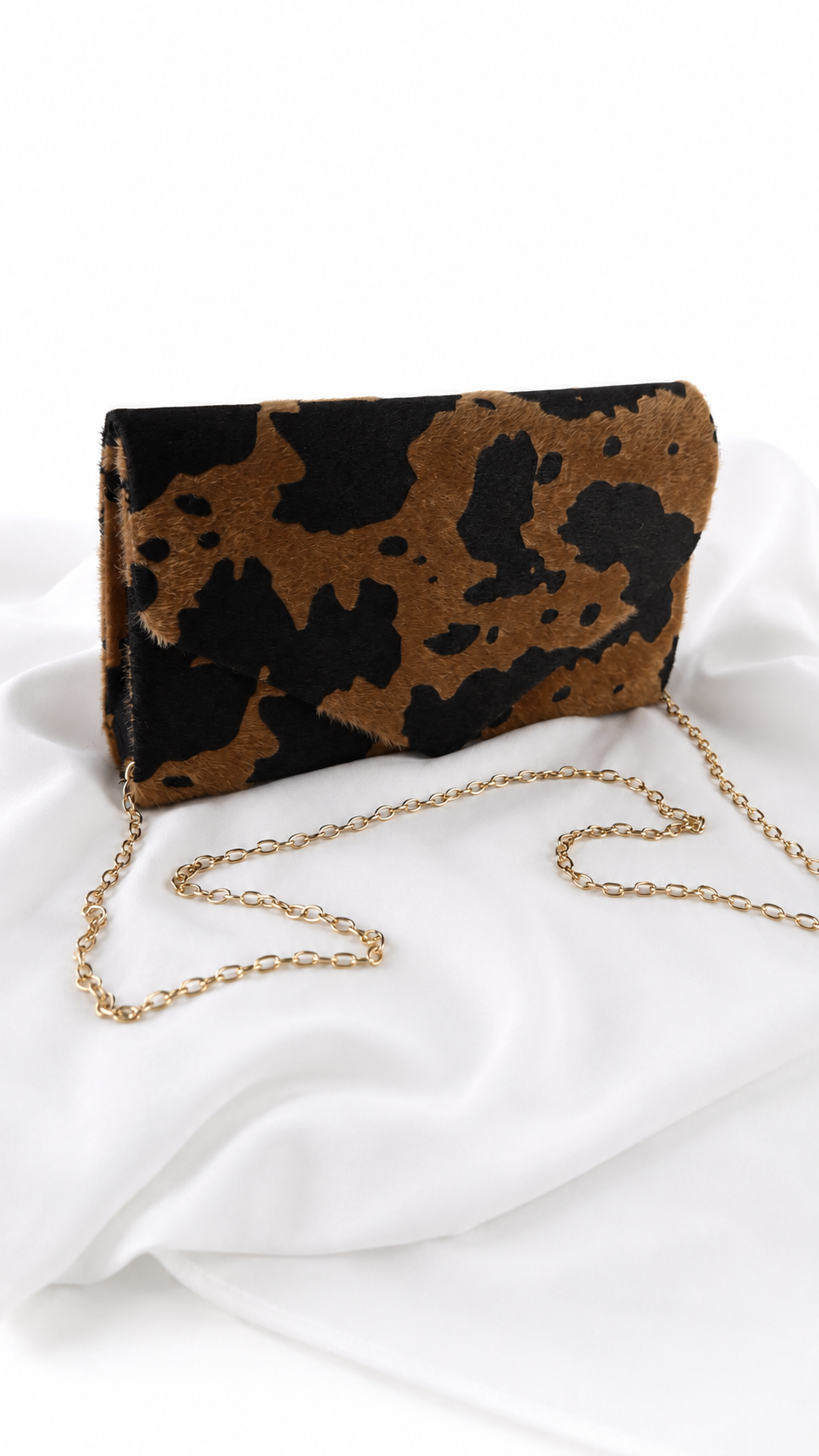 Pochette animalier effetto cavallino con stampa muccata